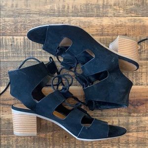 Black sandals with a heel.